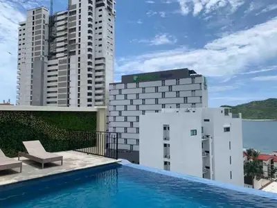 Piscina en o cerca de Espectacular condo en Blue Marlin Zona Dorada Beach