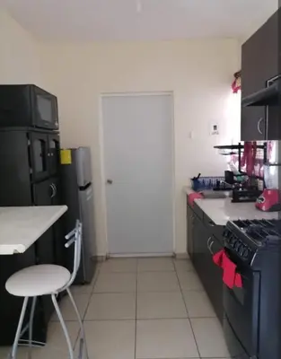 Una cocina o zona de cocina en Excelente casa cómoda