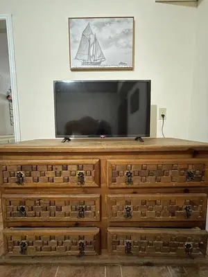 Una televisión o centro de entretenimiento en Casa De la Rosa