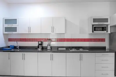 Una cocina o zona de cocina en Apartamentos Torre II Condominios - Pet Friendly