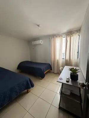 Cama o camas de una habitación en Casa Ceiba-Hospital Angeles