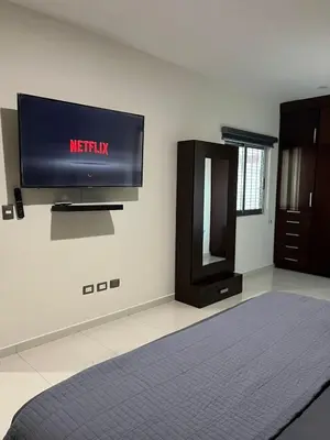 Una televisión o centro de entretenimiento en QB Departamento de lujo en Quintas espacioso y confortable