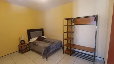 Cama o camas de una habitación en Departamento cora