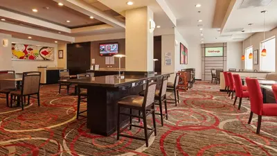 Una televisión o centro de entretenimiento en Holiday Inn Express & Suites Chihuahua Juventud by IHG