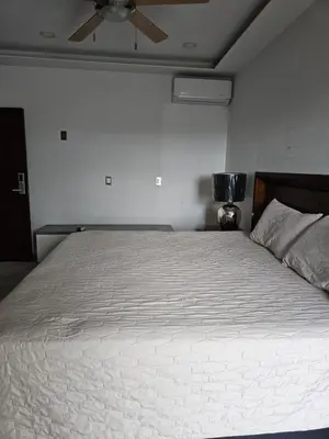Cama o camas de una habitación en Departamento estilo Hotel