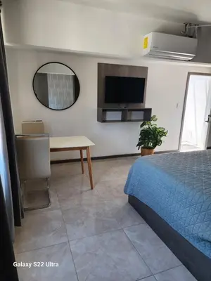 Una televisión o centro de entretenimiento en San sebastian Cataleya suites