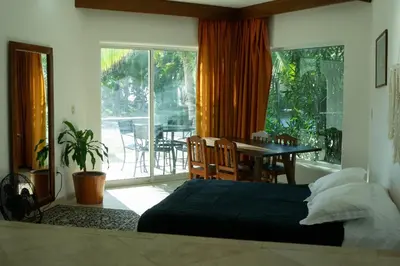 Cama o camas de una habitación en Departamentos y cabañas a pie de playa -Baraka Beach Club