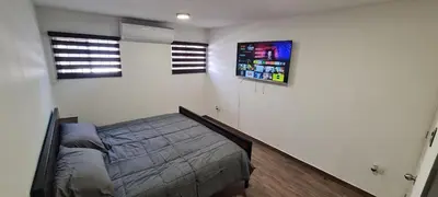 Cama o camas de una habitación en Casa cómoda y completa con 2 camas king size y 1 cama twin