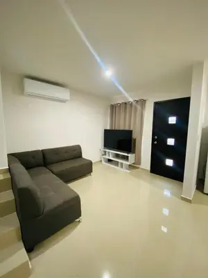 Una televisión o centro de entretenimiento en Residencia completa cerca de zona norte