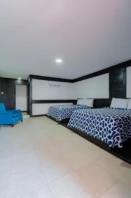 Cama o camas de una habitación en Hotel Belmar