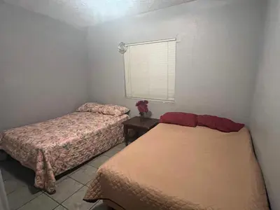 Cama o camas de una habitación en departamentos MAC 2