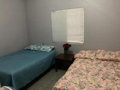 Cama o camas de una habitación en departamentos MAC 2