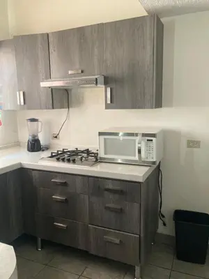 Una cocina o zona de cocina en departamentos MAC 2