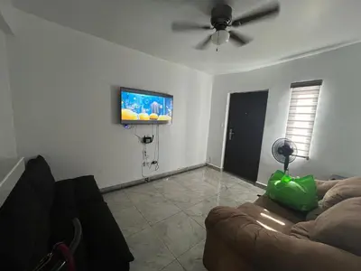 Una televisión o centro de entretenimiento en Departamentos MAC