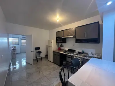 Una cocina o zona de cocina en Departamentos MAC