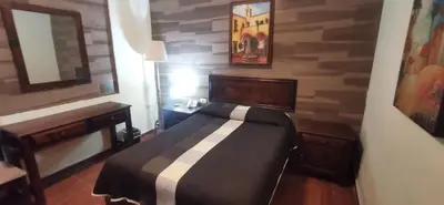 Cama o camas de una habitación en Hotel La Posta