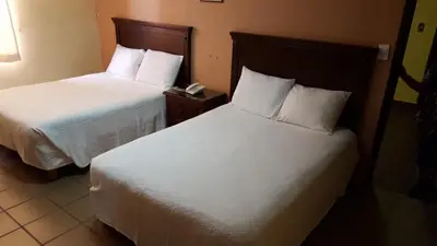 Cama o camas de una habitación en Hotel La Posta