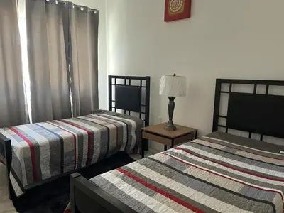 Cama o camas de una habitación en Departamento a metros de la playa