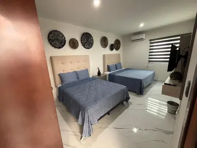 Cama o camas de una habitación en Casa palmera y sol
