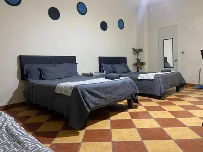 Cama o camas de una habitación en Edificio Paraiso