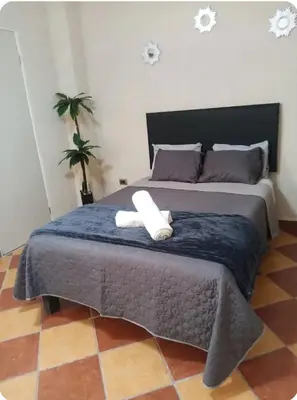 Cama o camas de una habitación en Edificio Paraiso