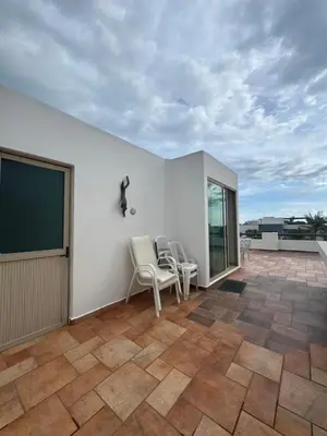 Un balcón o terraza de Casa de playa, a pasos del mar