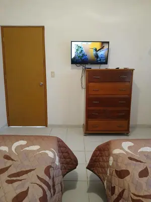 Una televisión o centro de entretenimiento en Casa Laura
