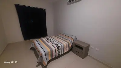 Cama o camas de una habitación en Departmento en Mazatlán