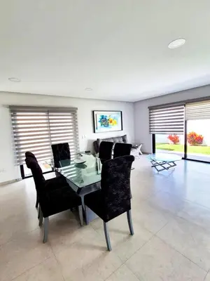 Una televisión o centro de entretenimiento en Residencial De Lujo Playas Brujas Alberca y Playa