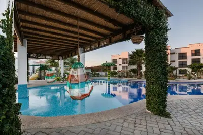Plano de A residence with 4 bedrooms in a private community with a swimming pool