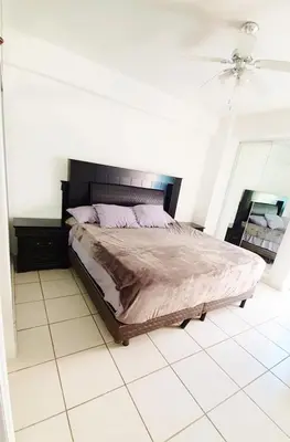 Cama o camas de una habitación en Miramar Depto de Lujo Frente Playa y Malecón