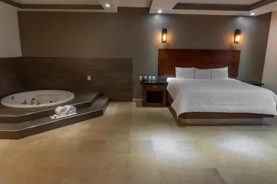Cama o camas de una habitación en Hotel Hacienda del Real & Casa Real Coffe Restaurant