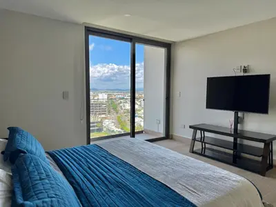 Cama o camas de una habitación en Hermoso Depa sobre el Malecón