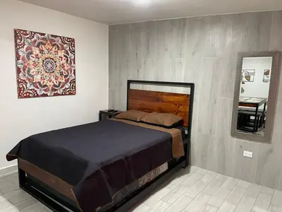 Cama o camas de una habitación en Loft centrito