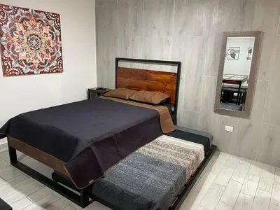 Cama o camas de una habitación en Loft centrito