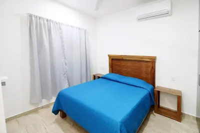 Cama o camas de una habitación en Depa Reginas a unos pasos del malecón 2