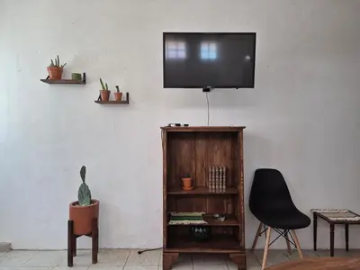 Una televisión o centro de entretenimiento en Departamento en Centro Histórico HMO