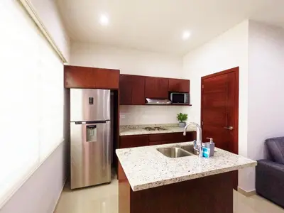 Una cocina o zona de cocina en Isla Esmeralda Azul 1 Min Playa y Zona Dorada