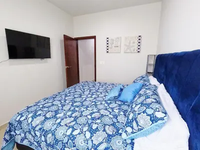 Cama o camas de una habitación en Isla Esmeralda Azul 1 Min Playa y Zona Dorada