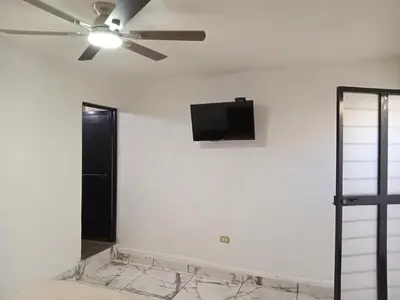 Una televisión o centro de entretenimiento en La Terraza-Habitación 6