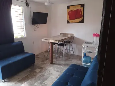 Una televisión o centro de entretenimiento en Departamentos Vacacionales ISB