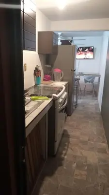Una cocina o zona de cocina en Departamentos Vacacionales ISB