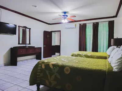 Cama o camas de una habitación en Hotel oasis suites