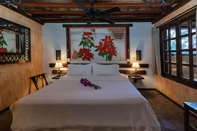 Cama o camas de una habitación en Posada de las Flores Loreto