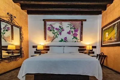 Cama o camas de una habitación en Posada de las Flores Loreto
