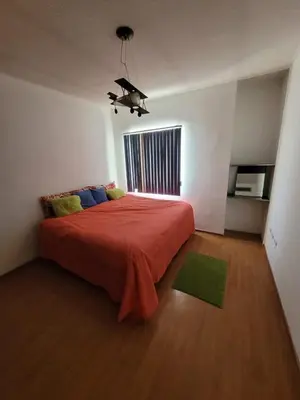 Cama o camas de una habitación en Amplia Casa