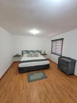 Cama o camas de una habitación en Amplia Casa