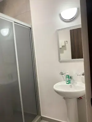 Un baño de Departamento arcangel residencial