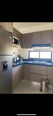 Una cocina o zona de cocina en Departamento arcangel residencial