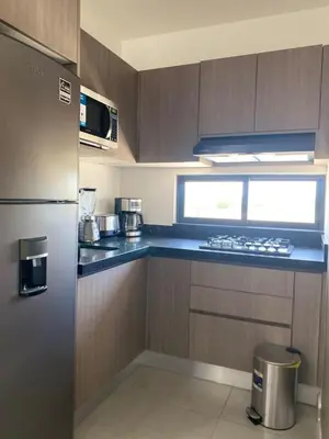 Una cocina o zona de cocina en Departamento arcangel residencial